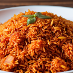 **

A close-up shot of cooked Ghana Jollof rice, showcasing the distinct grains of Basmati rice. Emphasize the aromatic spices and vibrant color. Think "aromatic, non-sticky, flavorful Ghana Jollof, Basmati rice grains."

**